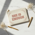 She Is Enough canvas cosmetic bag flat lay